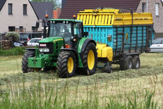 Farmer collecting hay.jpg